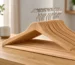 Wood clothes hangers wholesale bulk hardwood hangers for retail hotels and closets with custom finishes and volume pricing