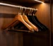 best hangers for hotels - luxury hotel closet with wooden anti-theft and velvet hangers