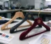 custom clothes hangers OEM ODM - factory samples with branded logos in multiple colors